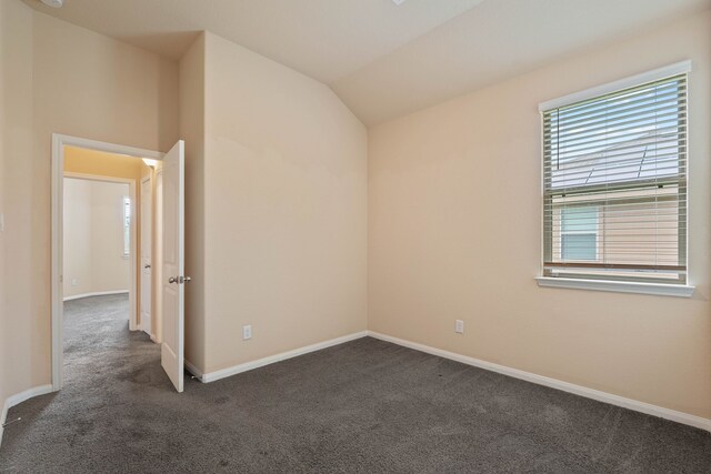 11053 Patriot Ct, Cleveland, TX 77328 - unfurnished room featuring dark carpet and lofted ceiling