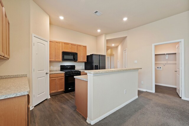 11053 Patriot Ct, Cleveland, TX 77328 - kitchen with black appliances, a center island, light countertops, recessed lighting, and dark wood-style floors