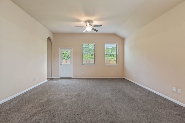 11053 Patriot Ct, Cleveland, TX 77328 - unfurnished room featuring ceiling fan, arched walkways, and dark colored carpet
