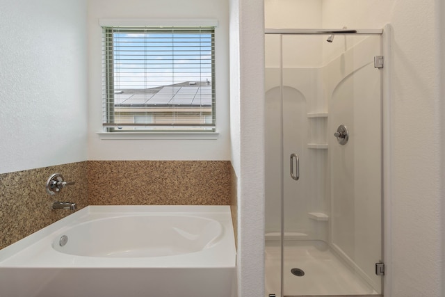11053 Patriot Ct, Cleveland, TX 77328 - bathroom featuring a shower stall and a bath