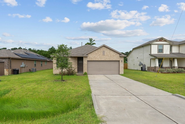 11053 Patriot Ct, Cleveland, TX 77328 - view of front of property featuring brick siding, driveway, a front lawn, and a garage