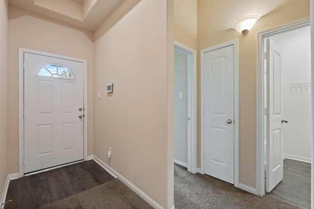 11053 Patriot Ct, Cleveland, TX 77328 - entrance foyer featuring baseboards and dark carpet
