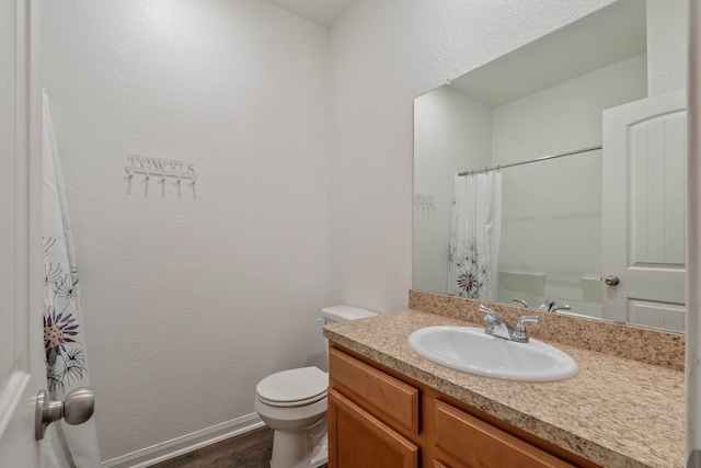 11053 Patriot Ct, Cleveland, TX 77328 - bathroom featuring vanity, wood finished floors, and a shower with curtain