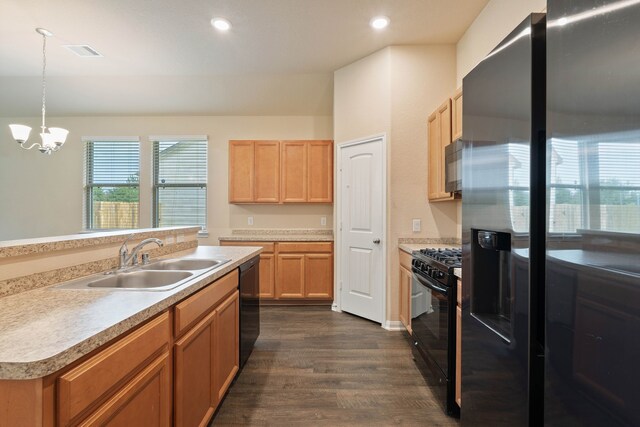 11053 Patriot Ct, Cleveland, TX 77328 - kitchen with black appliances, dark wood-style floors, a chandelier, light countertops, and recessed lighting