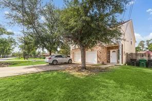 8101 Gallahad St Unit A B, Houston, TX 77078 - view of front facade with a garage, driveway, and a front yard