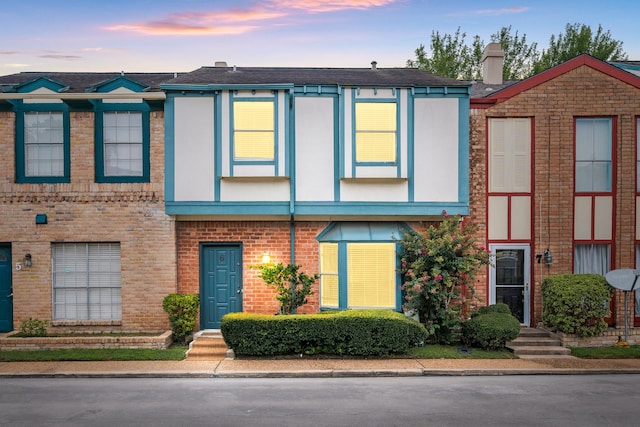 7700 Creekbend Dr Unit 6, Houston, TX 77071 - view of front of house featuring brick siding and a chimney
