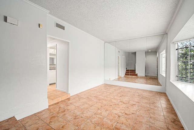 7700 Creekbend Dr Unit 6, Houston, TX 77071 - empty room with a textured ceiling and ornamental molding