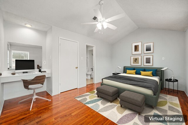7700 Creekbend Dr Unit 6, Houston, TX 77071 - bedroom featuring an office area, wood finished floors, lofted ceiling, connected bathroom, and a ceiling fan