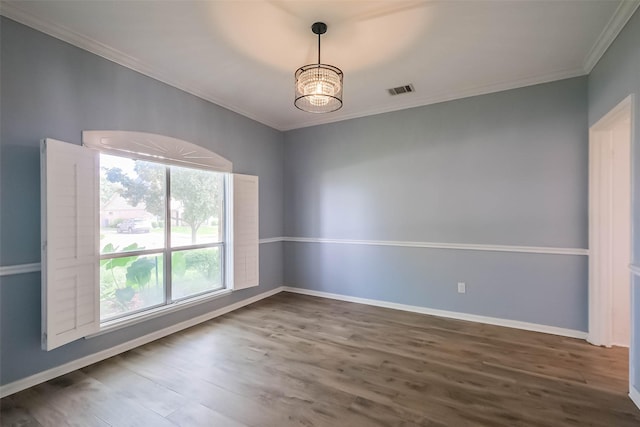 1711 Earl Of Dunmore St, Katy, TX 77449 - empty room featuring ornamental molding, wood finished floors, and a chandelier