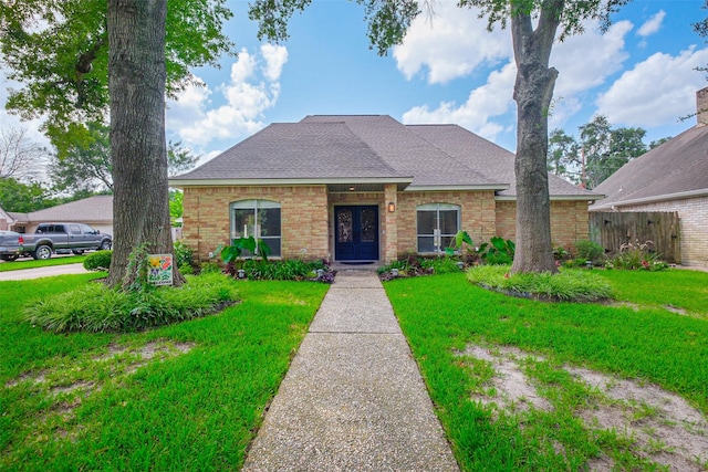 1711 Earl Of Dunmore St, Katy, TX 77449 - view of front of property with french doors, a shingled roof, and brick siding
