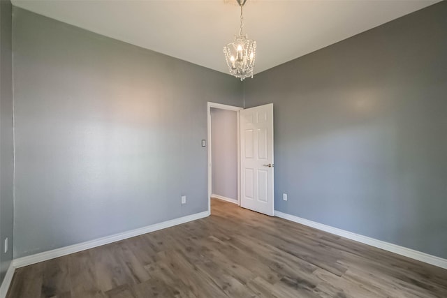 1711 Earl Of Dunmore St, Katy, TX 77449 - empty room featuring a chandelier and wood finished floors