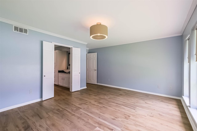 1711 Earl Of Dunmore St, Katy, TX 77449 - unfurnished bedroom with crown molding and wood finished floors