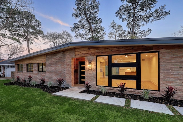 6110 Yarwell Dr, Houston, TX 77096 - view of front facade with a front lawn and brick siding