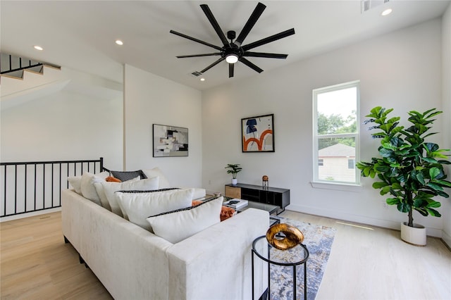 2310 Reinerman St, Houston, TX 77007 - living area featuring ceiling fan, light wood-type flooring, recessed lighting, and stairway