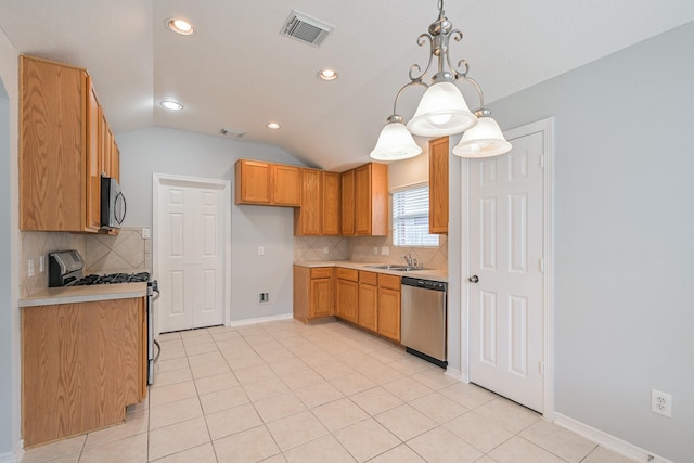 1518 Bugle Run Dr, Katy, TX 77449 - kitchen with stainless steel appliances, vaulted ceiling, decorative backsplash, light countertops, and pendant lighting