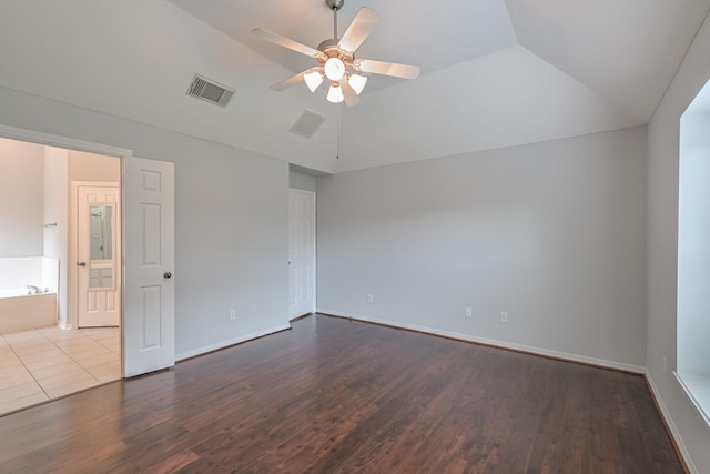 1518 Bugle Run Dr, Katy, TX 77449 - unfurnished bedroom with lofted ceiling, dark wood-style flooring, and a ceiling fan