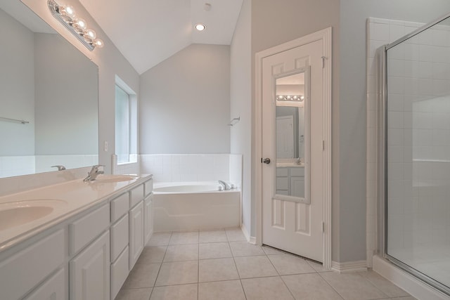 1518 Bugle Run Dr, Katy, TX 77449 - full bathroom featuring a bath, double vanity, tile patterned floors, vaulted ceiling, and a shower stall