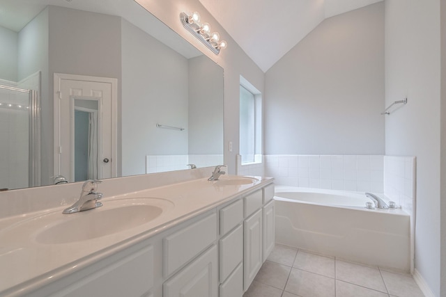 1518 Bugle Run Dr, Katy, TX 77449 - full bathroom featuring tile patterned floors, vaulted ceiling, a bath, double vanity, and a shower stall