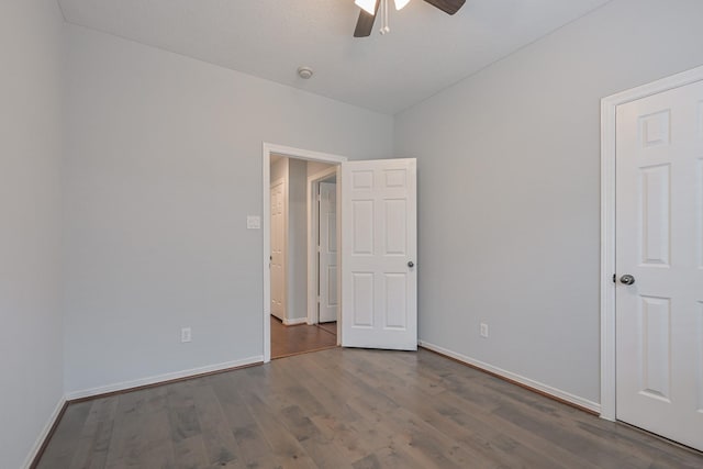 1518 Bugle Run Dr, Katy, TX 77449 - unfurnished bedroom with dark wood-type flooring, vaulted ceiling, and ceiling fan