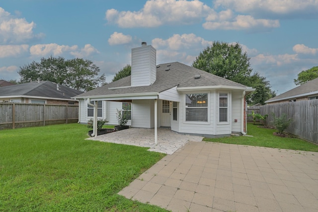 1518 Bugle Run Dr, Katy, TX 77449 - rear view of house with a patio, a chimney, a fenced backyard, and a shingled roof