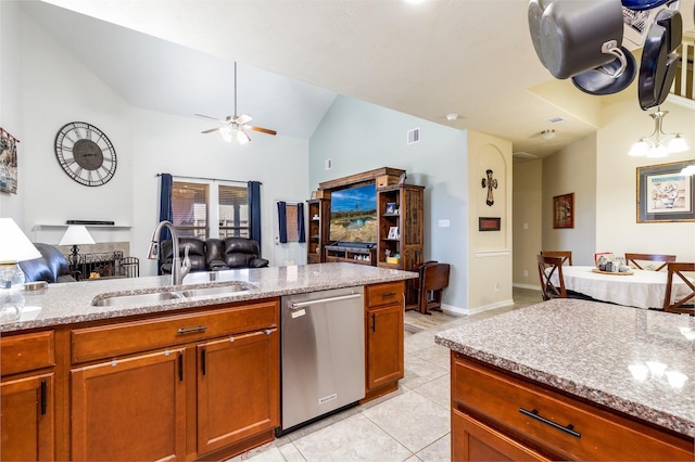 11443 Northam Dr, Tomball, TX 77375 - kitchen with dishwasher, open floor plan, light tile patterned flooring, lofted ceiling, and brown cabinetry