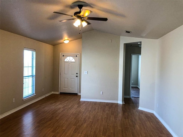 113 Bolero Way, Huntsville, TX 77340 - entryway with ceiling fan, lofted ceiling, dark wood-style floors, and a textured ceiling