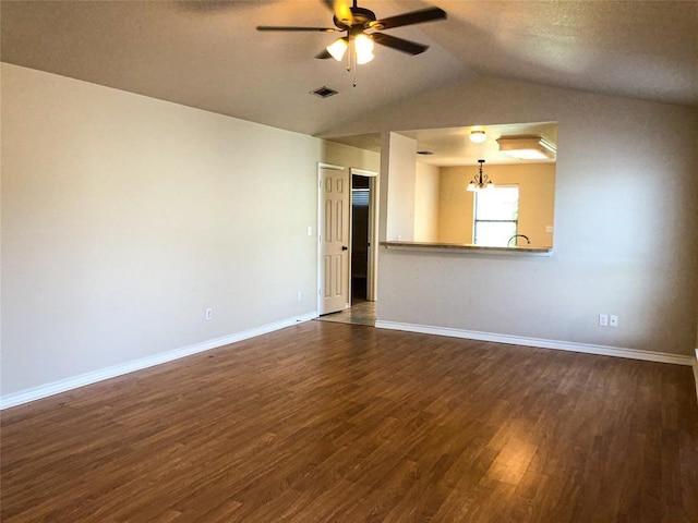 113 Bolero Way, Huntsville, TX 77340 - spare room featuring a ceiling fan, dark wood-style floors, a chandelier, and vaulted ceiling
