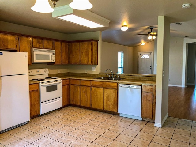 113 Bolero Way, Huntsville, TX 77340 - kitchen with white appliances, brown cabinetry, light tile patterned flooring, ceiling fan, and lofted ceiling