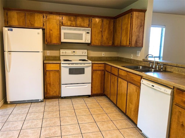 113 Bolero Way, Huntsville, TX 77340 - kitchen with white appliances, brown cabinetry, and light tile patterned flooring