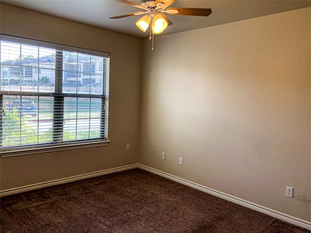 113 Bolero Way, Huntsville, TX 77340 - spare room featuring healthy amount of natural light, dark colored carpet, and a ceiling fan