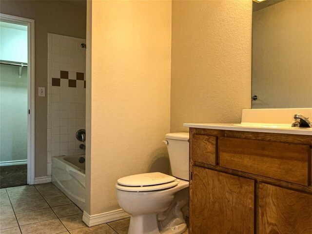 113 Bolero Way, Huntsville, TX 77340 - full bathroom with tile patterned floors, vanity, bathtub / shower combination, and a textured wall