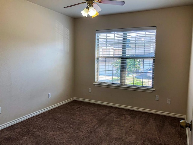 113 Bolero Way, Huntsville, TX 77340 - empty room featuring healthy amount of natural light, dark carpet, and a ceiling fan