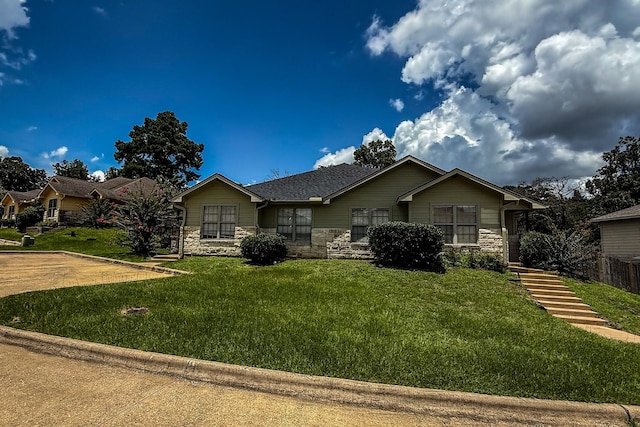 113 Bolero Way, Huntsville, TX 77340 - single story home featuring stone siding and a front yard