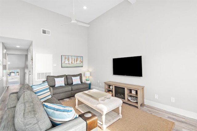 17711 Termini San Luis Pass Rd, Galveston, TX 77554 - living room with a ceiling fan, wood finished floors, high vaulted ceiling, and recessed lighting