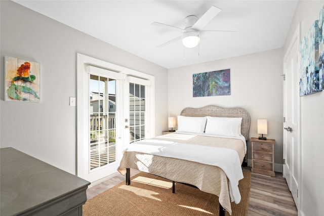 17711 Termini San Luis Pass Rd, Galveston, TX 77554 - bedroom with access to exterior, wood finished floors, multiple windows, and a ceiling fan