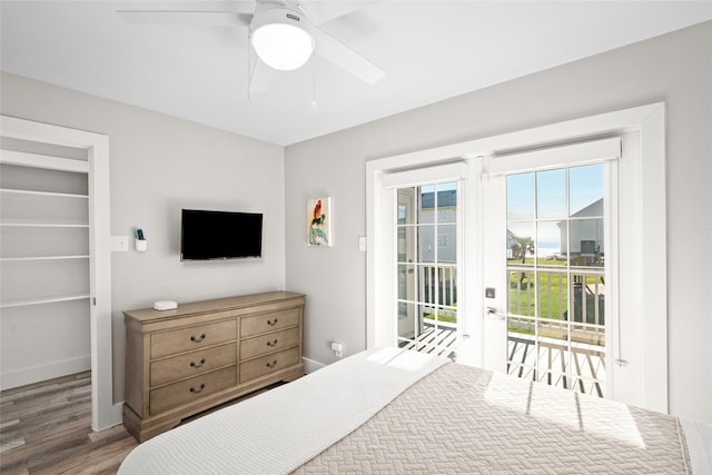 17711 Termini San Luis Pass Rd, Galveston, TX 77554 - bedroom featuring access to outside, wood finished floors, a spacious closet, and a ceiling fan