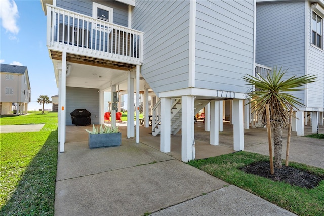 17711 Termini San Luis Pass Rd, Galveston, TX 77554 - view of patio / terrace with a carport, stairway, and grilling area