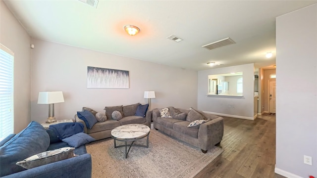 1855 Garnet Breeze Dr, Rosharon, TX 77583 - living room with wood finished floors and baseboards