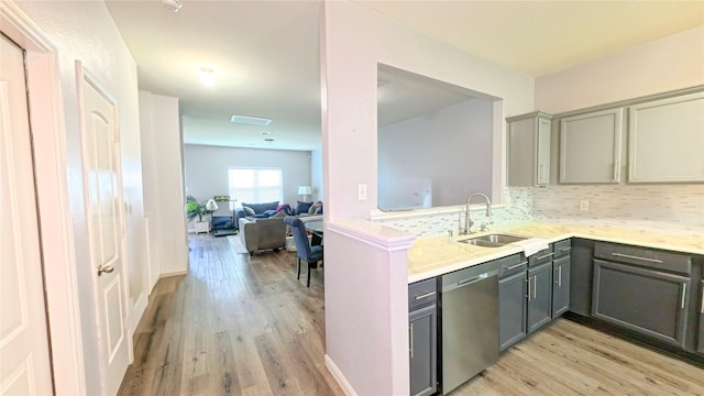 1855 Garnet Breeze Dr, Rosharon, TX 77583 - kitchen with stainless steel dishwasher, gray cabinets, light wood finished floors, and light countertops