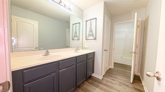 1855 Garnet Breeze Dr, Rosharon, TX 77583 - full bathroom featuring double vanity, wood finished floors, and shower / bath combination with curtain