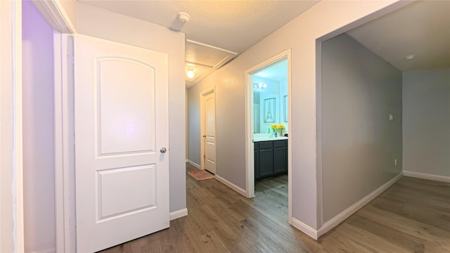 1855 Garnet Breeze Dr, Rosharon, TX 77583 - hall featuring light wood finished floors and attic access