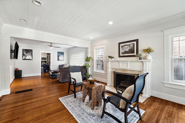 3404 Audubon Pl, Houston, TX 77006 - living room with a fireplace with flush hearth, wood finished floors, ornamental molding, recessed lighting, and a ceiling fan