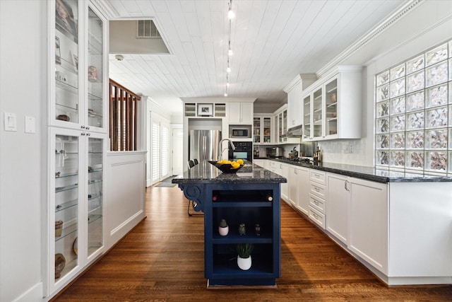3404 Audubon Pl, Houston, TX 77006 - kitchen with stainless steel appliances, track lighting, open shelves, white cabinetry, and wood ceiling