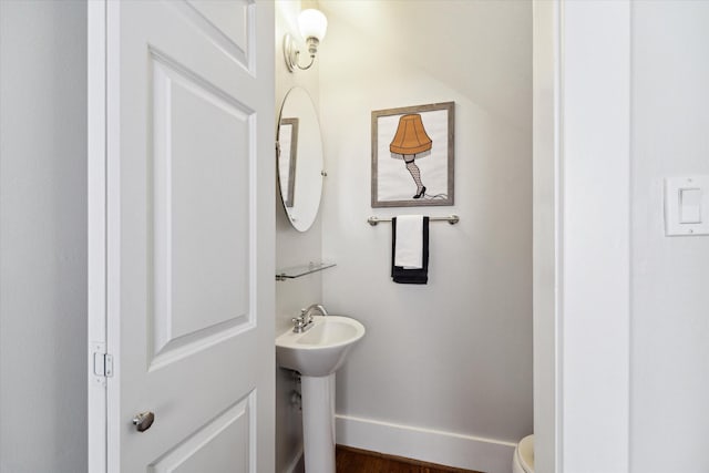 3404 Audubon Pl, Houston, TX 77006 - half bath featuring toilet and wood finished floors