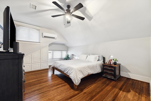 3404 Audubon Pl, Houston, TX 77006 - bedroom with a wall mounted AC, lofted ceiling, wood finished floors, and ceiling fan
