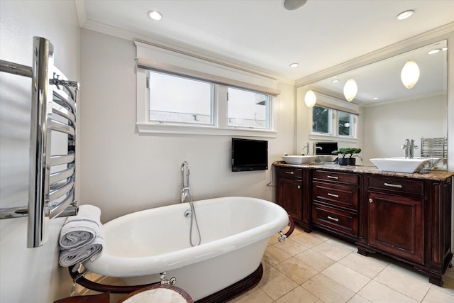 3404 Audubon Pl, Houston, TX 77006 - full bath with crown molding, a freestanding bath, double vanity, tile patterned floors, and recessed lighting