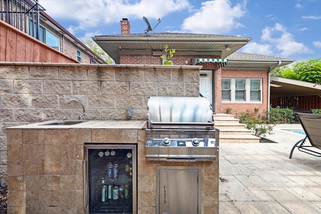 3404 Audubon Pl, Houston, TX 77006 - view of patio / terrace featuring beverage cooler and an outdoor kitchen