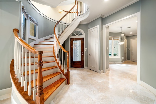 2217 Dunraven Ln, Houston, TX 77019 - foyer entrance with ornamental molding and stairs
