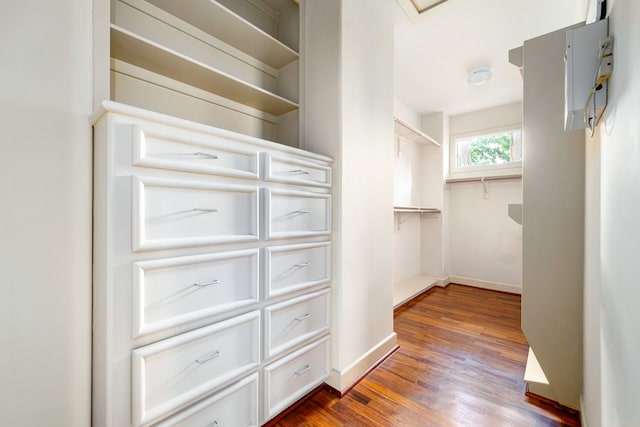 2217 Dunraven Ln, Houston, TX 77019 - walk in closet with dark wood-style flooring