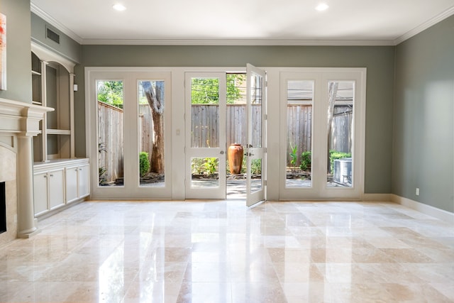 2217 Dunraven Ln, Houston, TX 77019 - doorway to outside featuring a fireplace, recessed lighting, crown molding, and marble tiled flooring